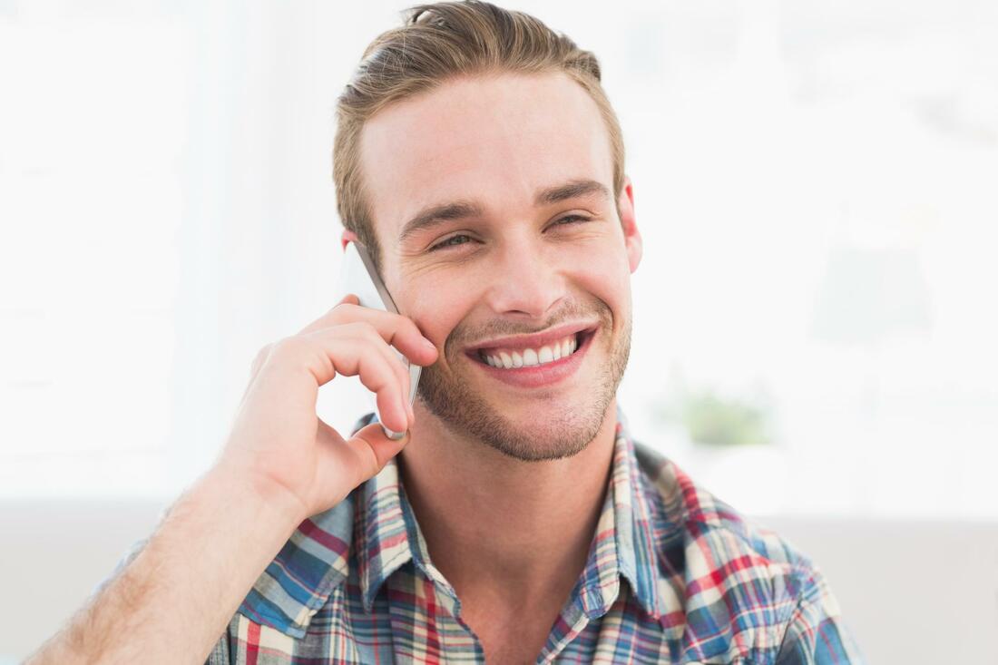Happy man talking on the phone